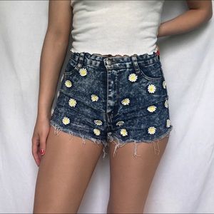 Denim shorts with daisy appliqués